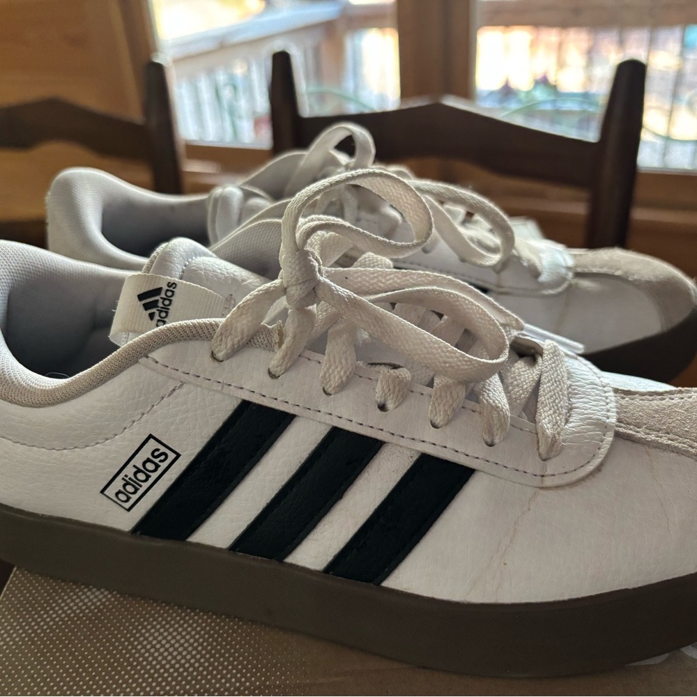Adidas Women’s White and Black Striped Sneakers.  Great condition.
